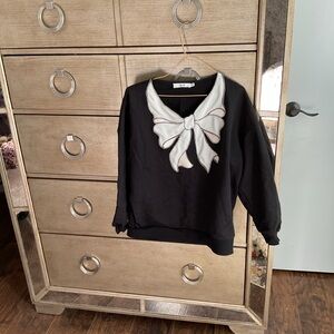 Black Sweatshirt with White Bow Design; size XS